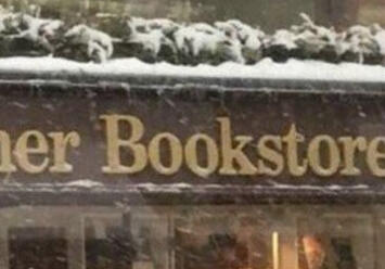 Book Review: Addie Larue picture of a "The Corner Bookstore" sign