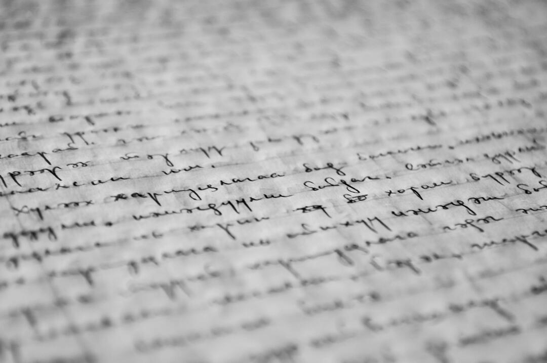 writing on a paper picture of cursive inked on a piece of paper
