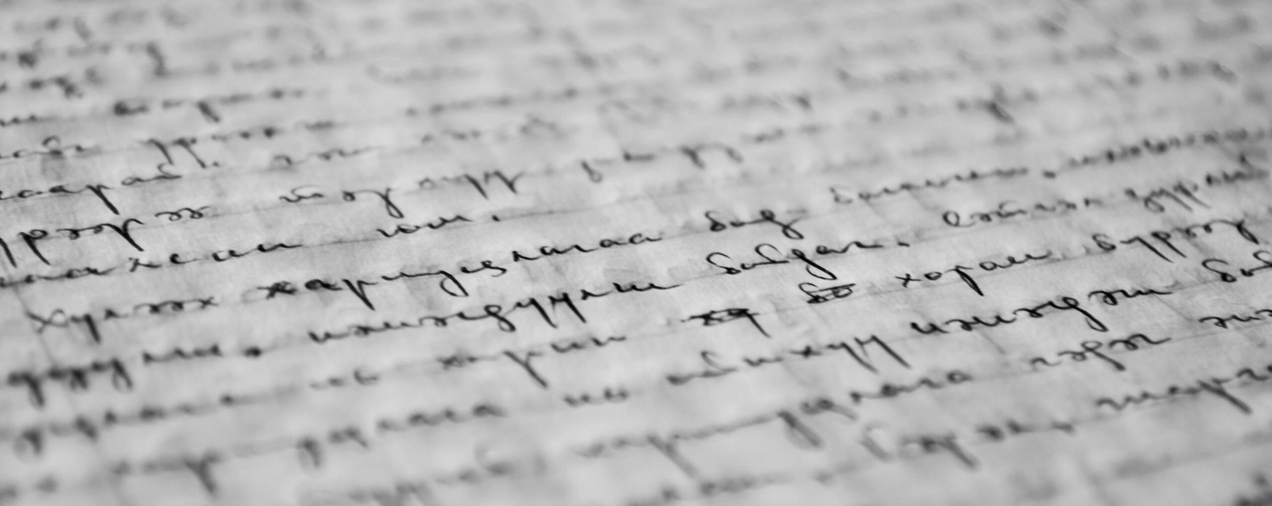 picture of cursive inked on a piece of paper