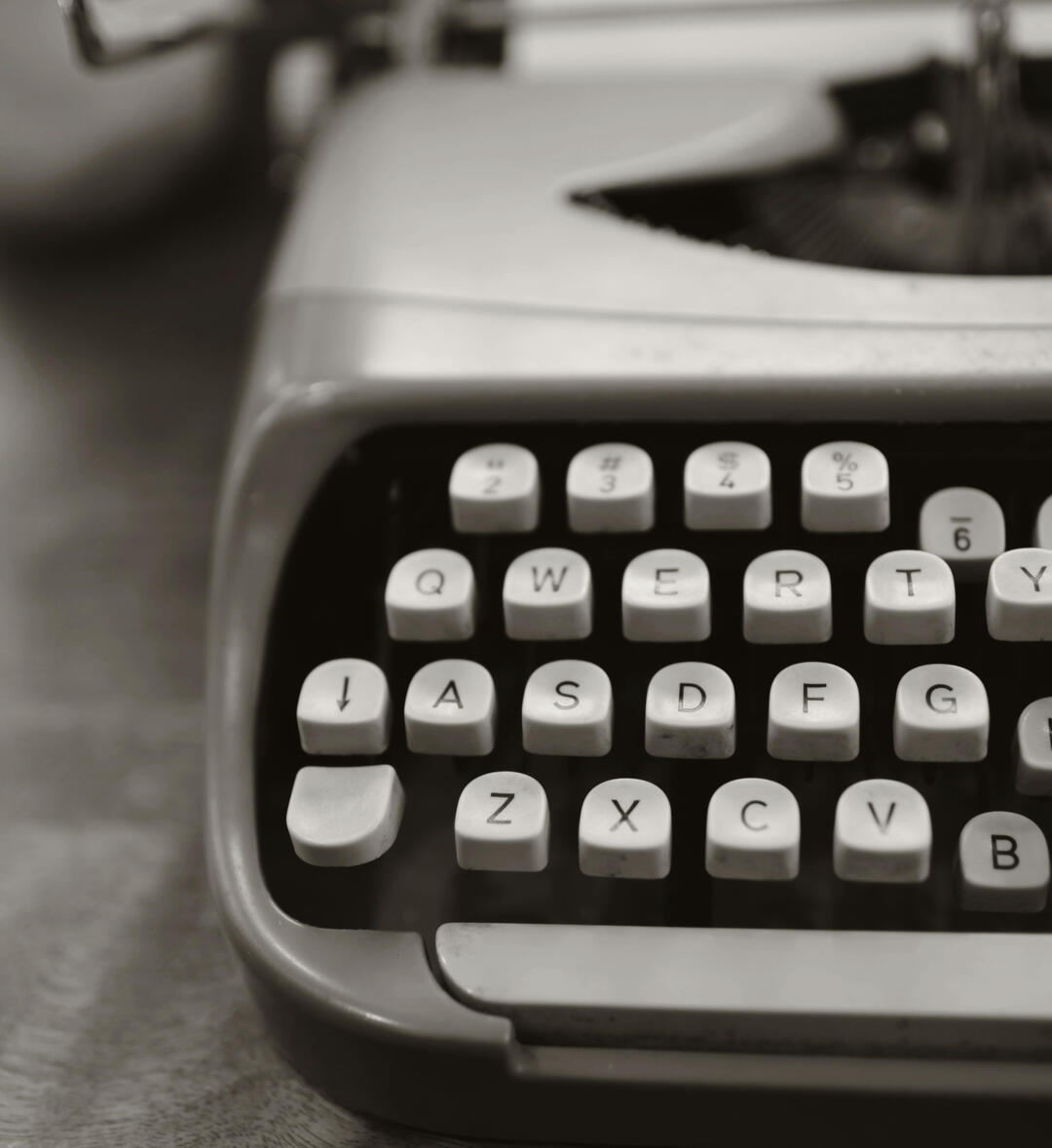 viyomiarts drawing of a girl with long black hair crouching with papers scattered around her